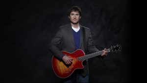 Dave Carroll with Taylor guitar
