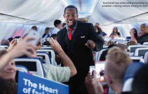 Flight Attendant walks through plane.